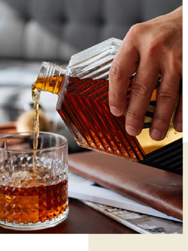 Whiskey being poured into a Glencairn glass at a Whiskey EDU tasting